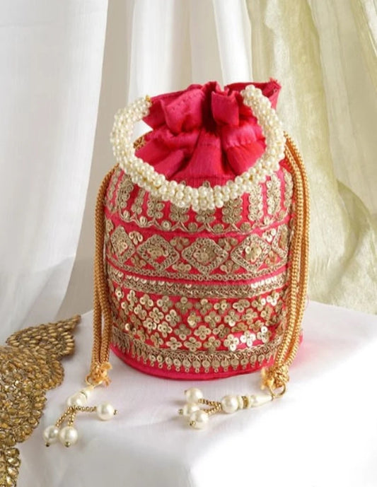 Embellished with Indian hand work potli bag