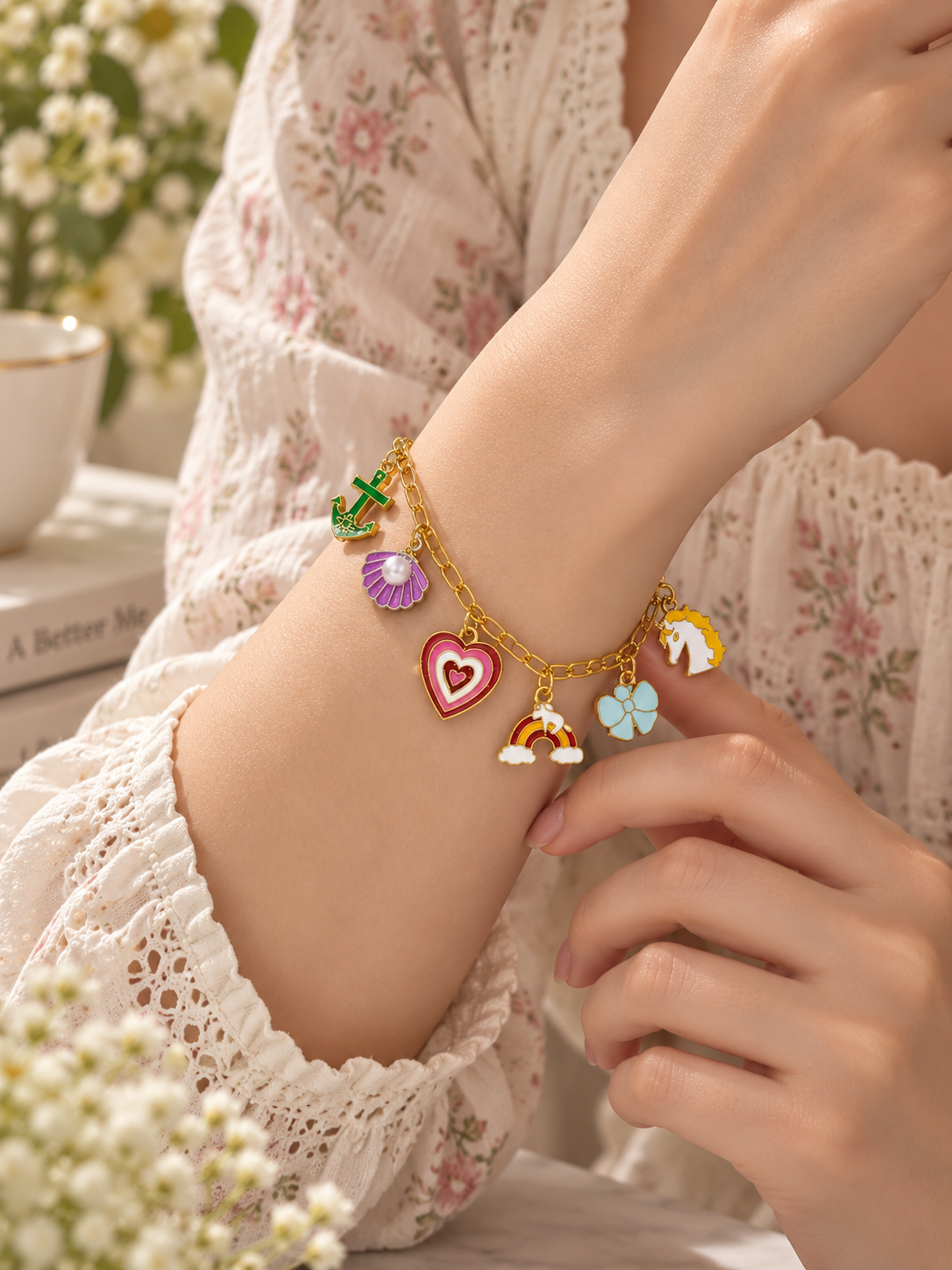 Colorful charm bracelet with gold-tone chain and cute enamel charms