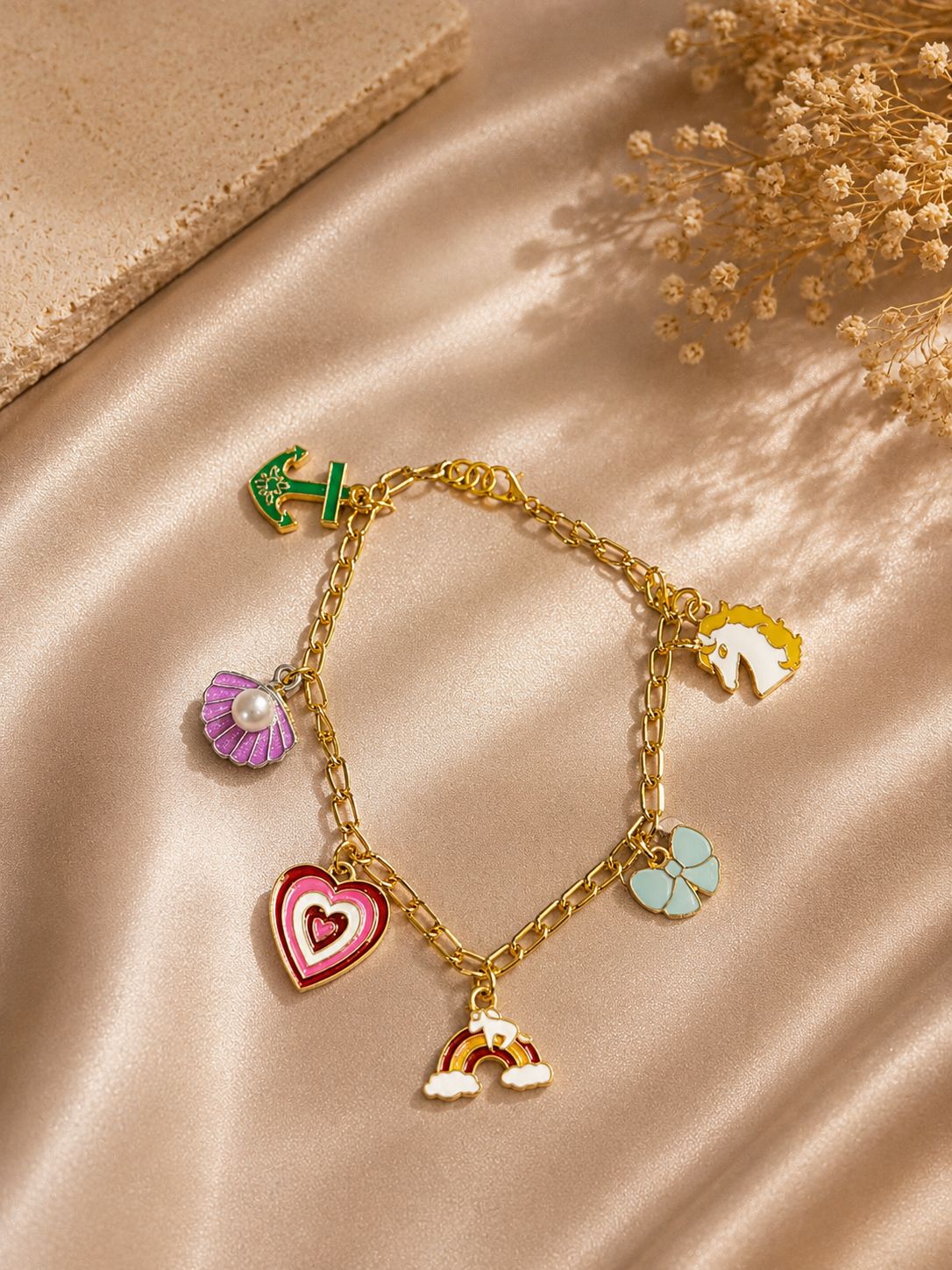 Colorful charm bracelet with gold-tone chain and cute enamel charms