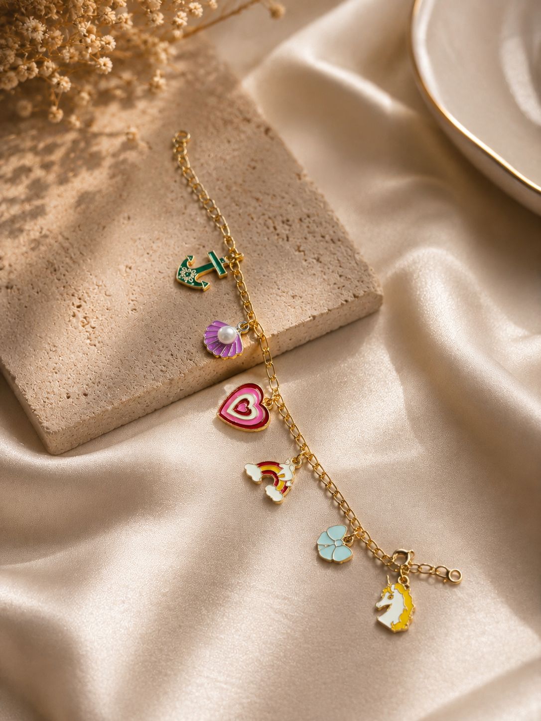 Colorful charm bracelet with gold-tone chain and cute enamel charms