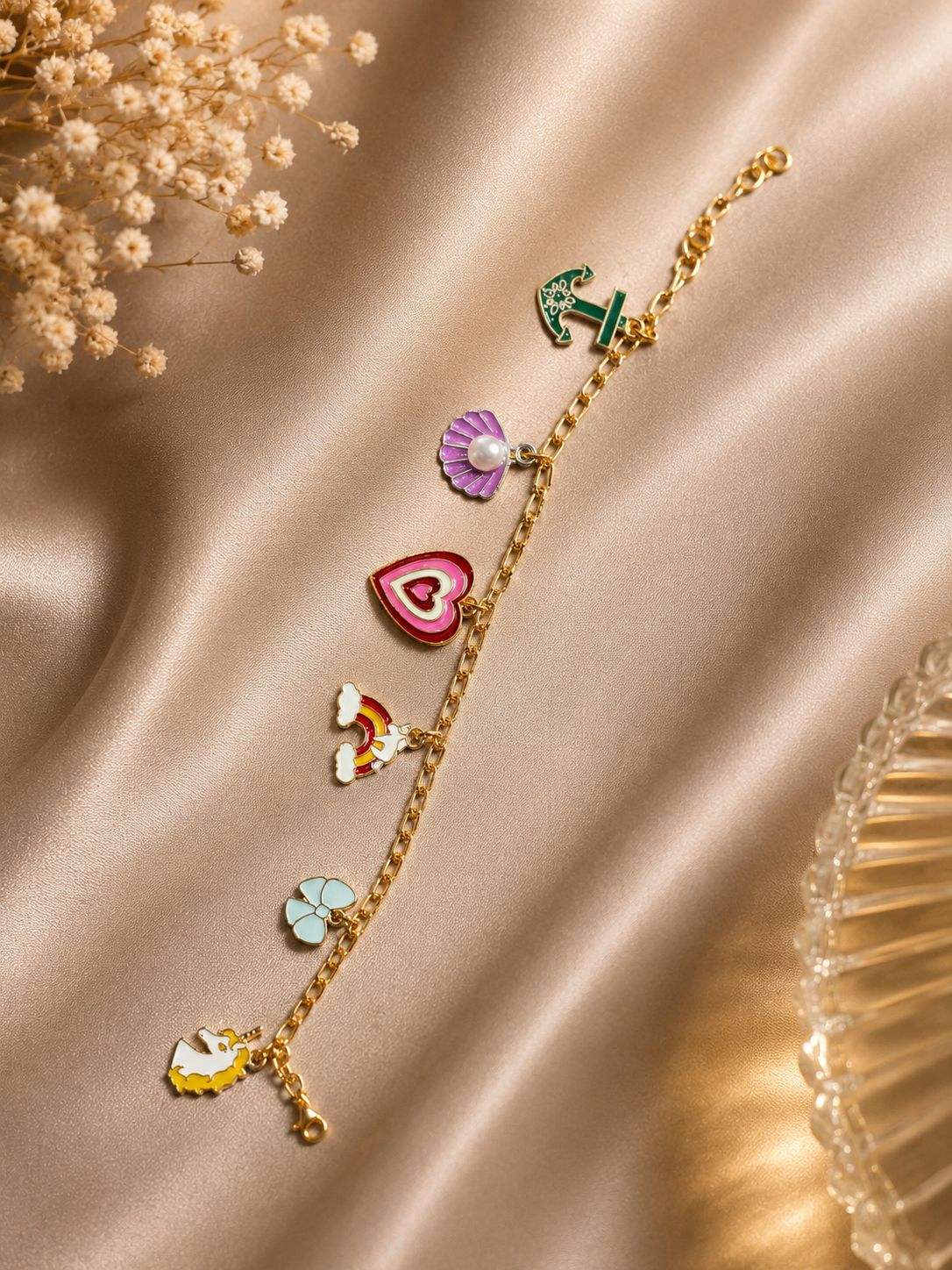 Colorful charm bracelet with gold-tone chain and cute enamel charms